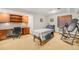 Versatile basement room with built-in desk, shelving, and ample space for fitness equipment at 4541 Christensen Cir, Littleton, CO 80123