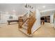 View of finished basement stairs leading to a spacious recreational area with a pool table at 4541 Christensen Cir, Littleton, CO 80123