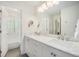 Spacious bathroom with marble countertops, double sinks, and modern fixtures at 4541 Christensen Cir, Littleton, CO 80123