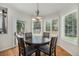 Charming breakfast nook with large windows and access to the backyard patio at 4541 Christensen Cir, Littleton, CO 80123