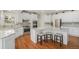 Gourmet kitchen with granite counters, stainless appliances, and center island with seating at 4541 Christensen Cir, Littleton, CO 80123