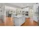 Modern kitchen with white cabinets, granite counters, and stainless steel appliances at 4541 Christensen Cir, Littleton, CO 80123