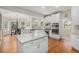 Modern kitchen with white cabinets, granite counters, and stainless steel appliances at 4541 Christensen Cir, Littleton, CO 80123