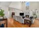 Bright living room with hardwood floors, fireplace, and plenty of natural light at 4541 Christensen Cir, Littleton, CO 80123