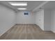 Finished basement featuring neutral carpeting, white walls, and a window for natural light at 9645 W 73Rd Pl, Arvada, CO 80005