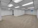 Spacious basement features neutral carpeting and a drop ceiling with recessed lighting at 9645 W 73Rd Pl, Arvada, CO 80005