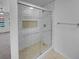 Modern bathroom features a walk-in shower with subway tile surround and a built-in shower niche at 9645 W 73Rd Pl, Arvada, CO 80005