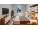 Cozy bedroom featuring a comfortable bed, modern dresser, and stylish decor at 9645 W 73Rd Pl, Arvada, CO 80005