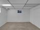 Carpeted bedroom featuring a drop ceiling and a window for natural light at 9645 W 73Rd Pl, Arvada, CO 80005