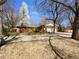 Charming brick home with mature trees and a well-maintained front yard at 9645 W 73Rd Pl, Arvada, CO 80005