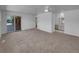 Spacious living room with a sliding door access to the backyard and a vanity at 9645 W 73Rd Pl, Arvada, CO 80005