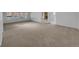 Spacious living room featuring neutral carpeting and ample natural light at 9645 W 73Rd Pl, Arvada, CO 80005