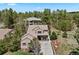 A well-situated house with mature trees, and lush landscaping for ultimate privacy and curb appeal at 5091 Hidden Pond Pl, Castle Rock, CO 80108