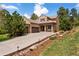 Charming home with a three-car garage, stone porch, and well-maintained landscaping for curb appeal at 5091 Hidden Pond Pl, Castle Rock, CO 80108
