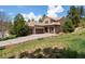 Charming home with a three-car garage, stone porch, and well-maintained landscaping for curb appeal at 5091 Hidden Pond Pl, Castle Rock, CO 80108