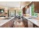 Open kitchen layout featuring a gas range, sleek countertops, and seamless access to the dining area at 5091 Hidden Pond Pl, Castle Rock, CO 80108