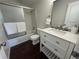 Updated bathroom showcasing modern vanity with quartz counters and a tiled shower at 12166 Melody Dr # 202, Denver, CO 80234
