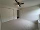 Cozy bedroom complete with a ceiling fan and closet space at 12166 Melody Dr # 202, Denver, CO 80234