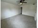Spacious bedroom featuring neutral carpeting and a ceiling fan at 12166 Melody Dr # 202, Denver, CO 80234