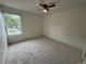 Inviting bedroom featuring a ceiling fan and street view at 12166 Melody Dr # 202, Denver, CO 80234