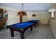 Features two pool tables and custom lights in this spacious game room; perfect for entertaining at 12166 Melody Dr # 202, Denver, CO 80234