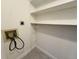 Functional laundry room with washer and dryer connections and built-in shelving at 12166 Melody Dr # 202, Denver, CO 80234