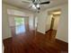 Open-concept living room with hardwood floors flows seamlessly into the updated kitchen at 12166 Melody Dr # 202, Denver, CO 80234