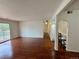 Bright living room featuring hardwood floors and sliding glass doors to outdoor space at 12166 Melody Dr # 202, Denver, CO 80234