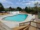 Inviting pool area with lounge chairs and well maintained grounds at 12166 Melody Dr # 202, Denver, CO 80234