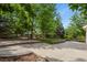 Spacious backyard and patio surrounded by mature trees and lush landscaping at 6533 S Ouray St, Aurora, CO 80016