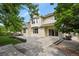 A spacious backyard features a patio and mature trees at 6533 S Ouray St, Aurora, CO 80016