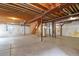 An unfinished basement offers exposed wood ceilings and a concrete floor at 6533 S Ouray St, Aurora, CO 80016