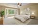 Serene bedroom with a bay window, soft carpet, and neutral decor at 6533 S Ouray St, Aurora, CO 80016