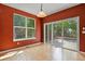 Dining room with wood floors, large windows, and sliding glass doors to the backyard at 6533 S Ouray St, Aurora, CO 80016
