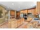 Spacious kitchen featuring granite countertops, island cooktop, and stainless appliances at 6533 S Ouray St, Aurora, CO 80016