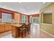 Open kitchen with a center island, modern appliances, and an outdoor patio view at 6533 S Ouray St, Aurora, CO 80016