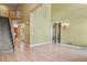 Spacious living room with hardwood floors, staircase, and access to multiple rooms at 6533 S Ouray St, Aurora, CO 80016