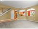 Spacious living room connects to the kitchen with open archways and adjacent staircase at 6533 S Ouray St, Aurora, CO 80016