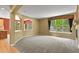 Open living room with archways, a fireplace, and a large window with natural light at 6533 S Ouray St, Aurora, CO 80016