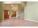 Spacious living room with gleaming hardwood floors and access to the upper levels at 6533 S Ouray St, Aurora, CO 80016