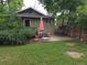 Outdoor patio with metal table and chairs in a lush backyard setting at 9075 W 66Th Ave, Arvada, CO 80004