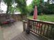 Outdoor patio with metal table and chairs in a lush backyard setting at 9075 W 66Th Ave, Arvada, CO 80004