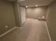 Spacious basement with carpeted floors, neutral walls, and recessed lighting at 9075 W 66Th Ave, Arvada, CO 80004