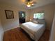 Comfortable bedroom with a ceiling fan and natural light from the window at 9075 W 66Th Ave, Arvada, CO 80004