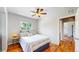 Bright bedroom featuring a ceiling fan, and a window for natural light at 9075 W 66Th Ave, Arvada, CO 80004