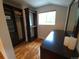 Walk-in closet with built-in shelving and storage space next to a dresser with mirror at 9075 W 66Th Ave, Arvada, CO 80004