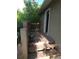 Wooden deck leading to the door with railing and a potted flower at 9075 W 66Th Ave, Arvada, CO 80004