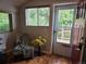 Charming entryway with hardwood floors, natural light, and a cozy seating area at 9075 W 66Th Ave, Arvada, CO 80004