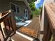 Inviting front porch with stylish outdoor seating, a patterned rug, and a 'Home Sweet Home' doormat at 9075 W 66Th Ave, Arvada, CO 80004