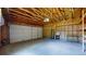 Spacious garage boasts high ceilings, offering ample storage and workshop potential at 9075 W 66Th Ave, Arvada, CO 80004